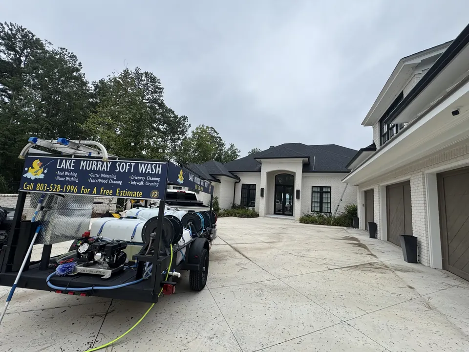 Lake Murray Soft Wash trailer parked at a large home, ready to pressure wash